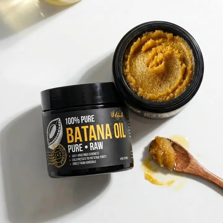 Vie Naturelle 100% Pure Batana Oil — open jar showing the raw golden oil